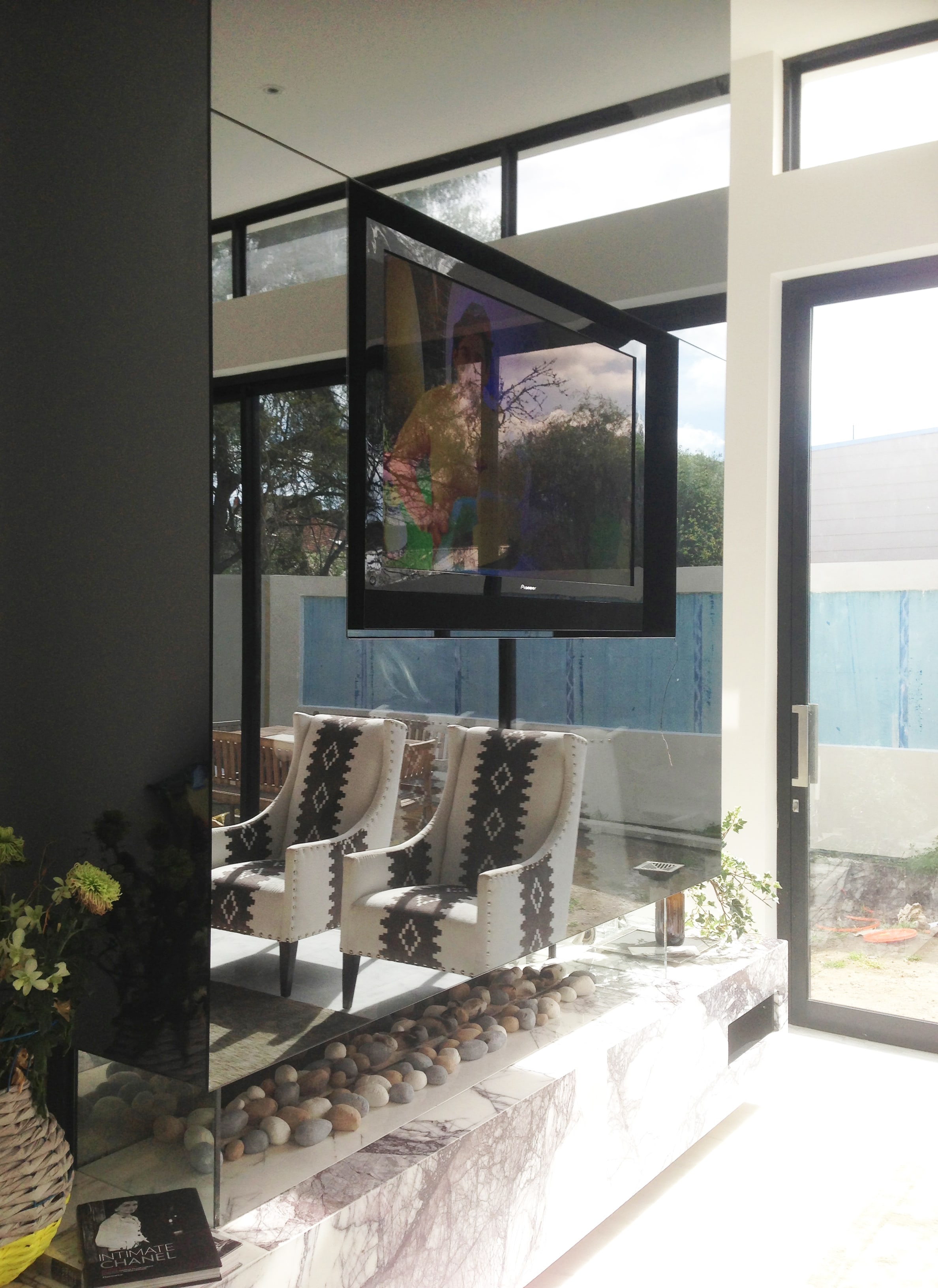 TV in Glass Wall Simply Frameless